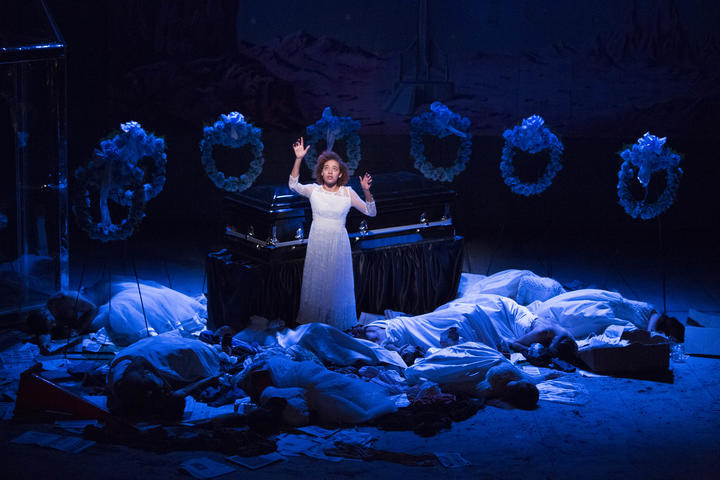 Aislinn Brophy in front of a coffin in A Dream Play